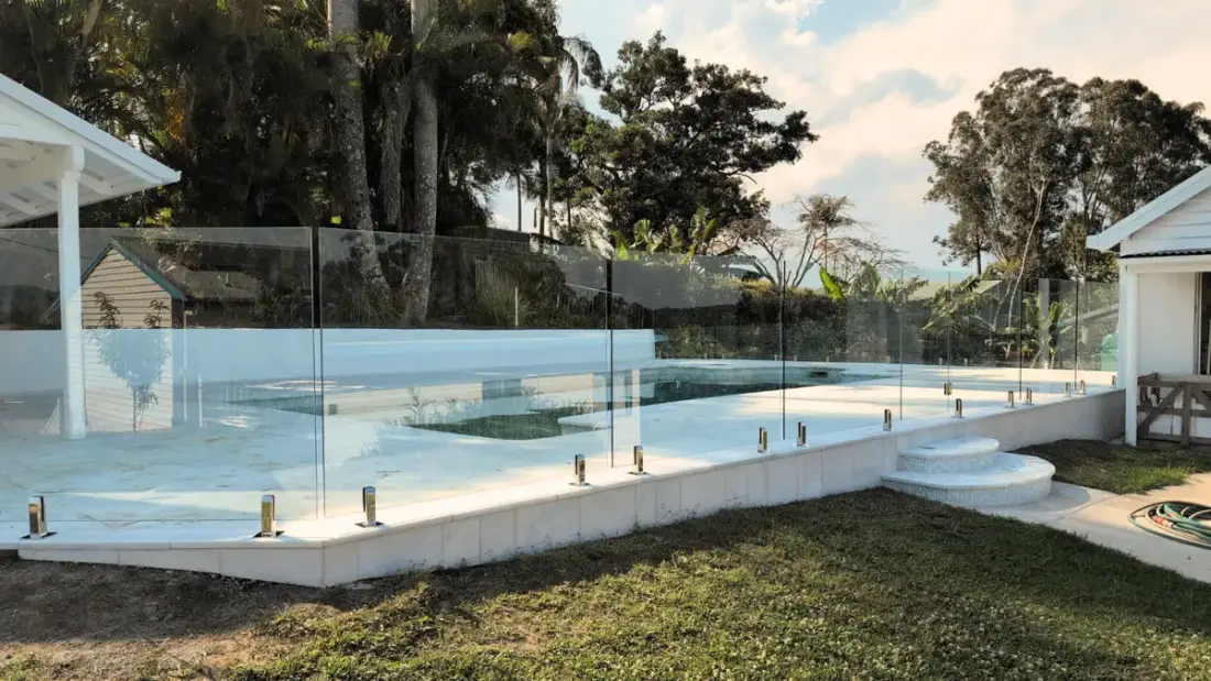 Frameless glass pool fence with unobstructed view of pool
