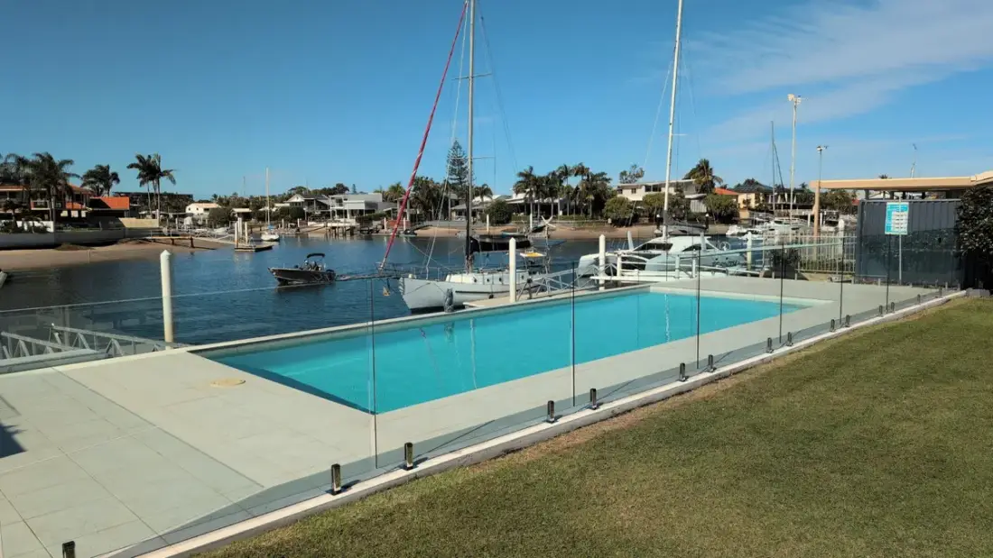 Frameless glass pool fence overlooking the marina